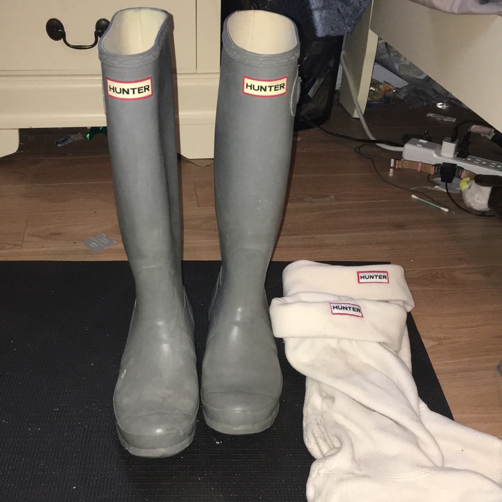 Dark grey tall hunter boots with socks